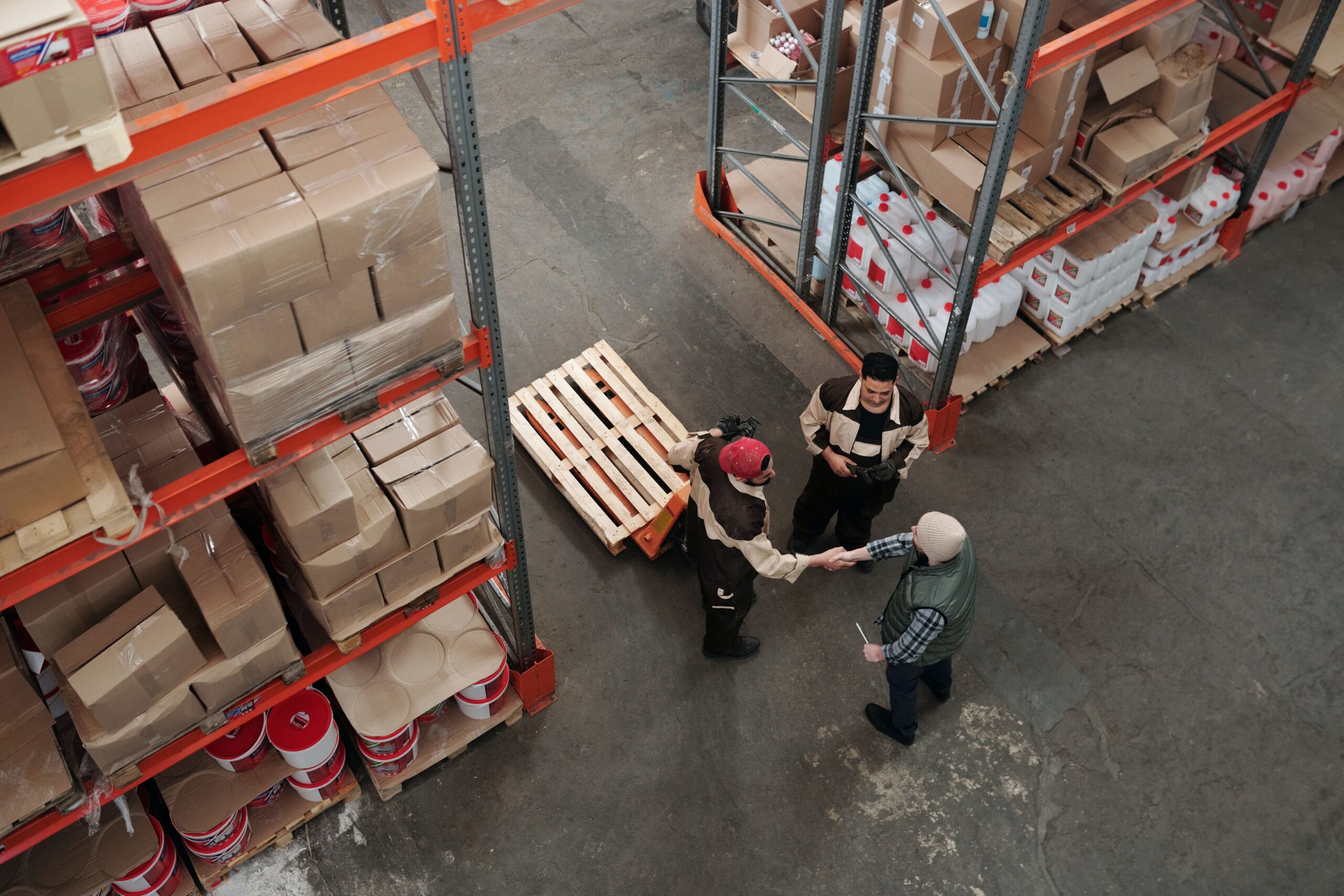 3 men working in a warehouse