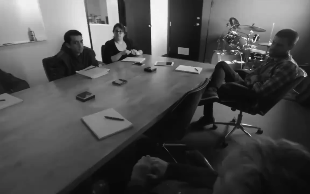 Team meeting at Alchemy Group’s modern office, showcasing collaboration and creativity